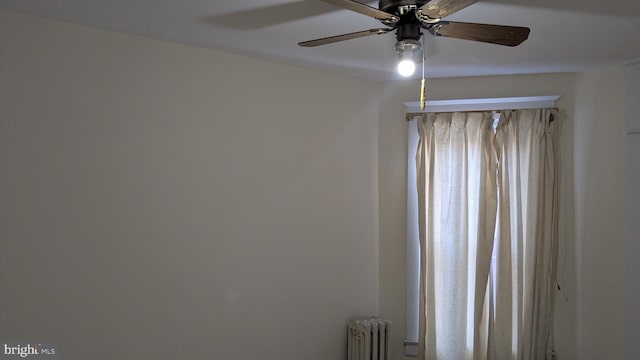 room details with ceiling fan and radiator heating unit