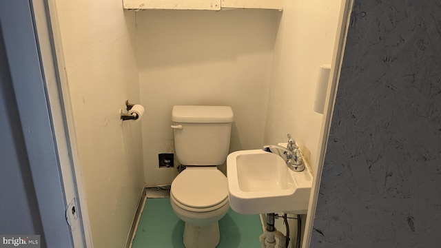 bathroom with toilet and sink