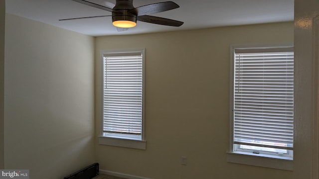 unfurnished room featuring ceiling fan