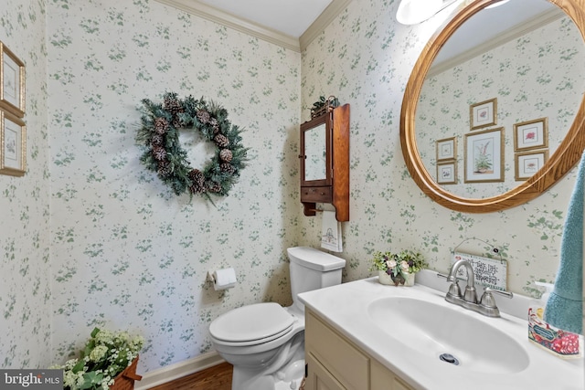 bathroom featuring crown molding, vanity, wood-type flooring, and toilet