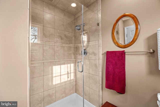 bathroom featuring an enclosed shower