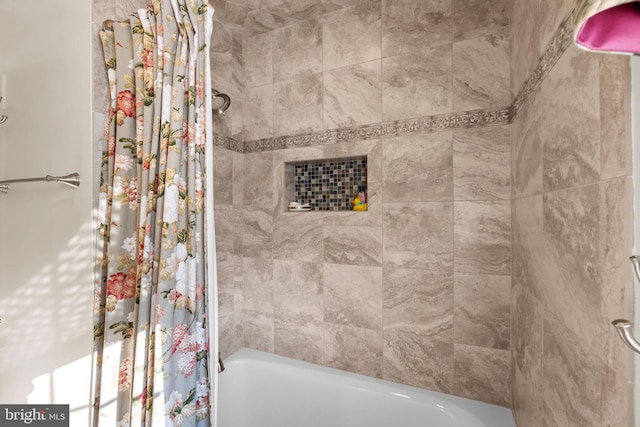 bathroom with shower / bath combination with curtain