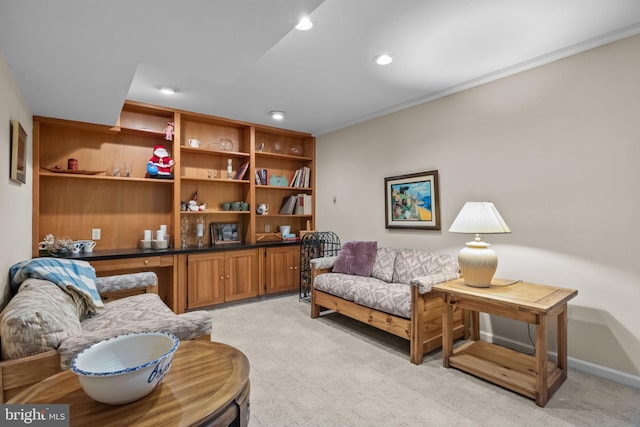 sitting room featuring light carpet