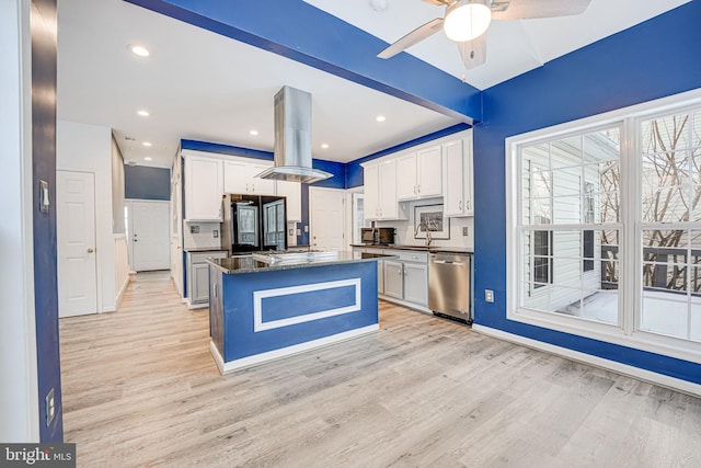 kitchen with island exhaust hood, white cabinetry, a kitchen island, and dishwasher