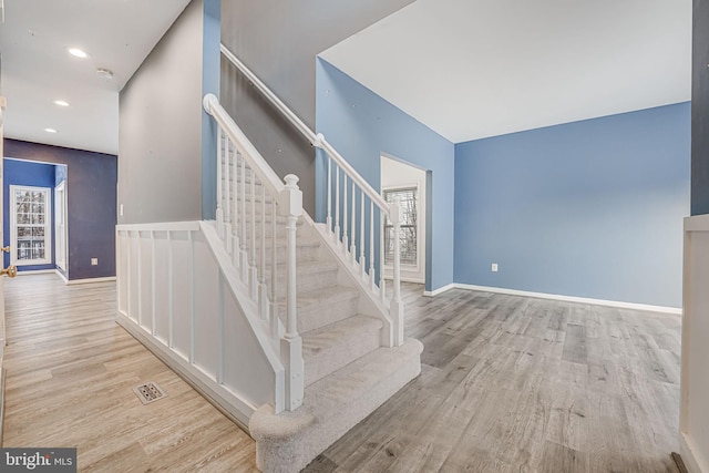 stairway with wood-type flooring