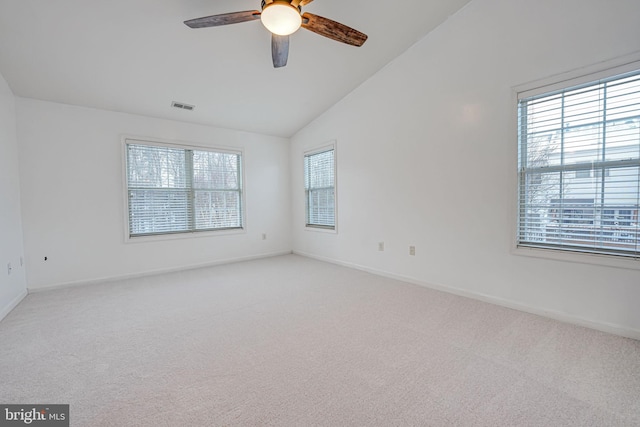 empty room with light carpet, ceiling fan, and lofted ceiling