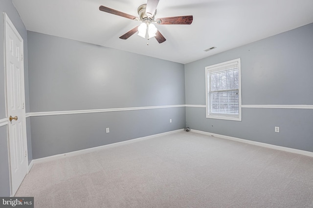 unfurnished room with ceiling fan and light colored carpet