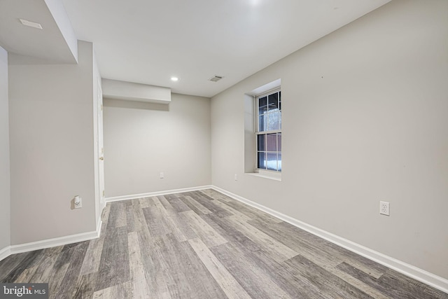 unfurnished room featuring light hardwood / wood-style floors