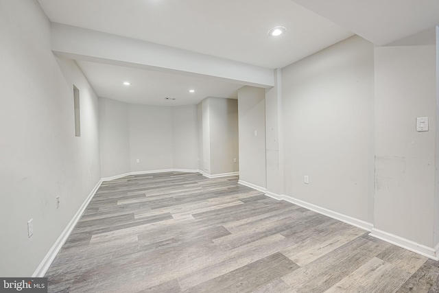 basement featuring light wood-type flooring