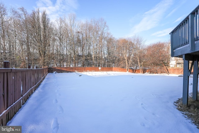 view of yard covered in snow