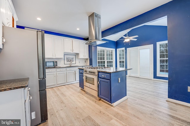 kitchen featuring decorative backsplash, appliances with stainless steel finishes, extractor fan, ceiling fan, and white cabinets