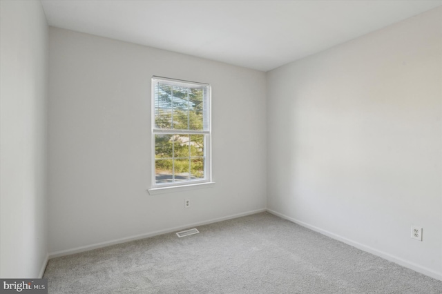 empty room featuring carpet flooring