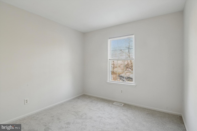 unfurnished room featuring carpet