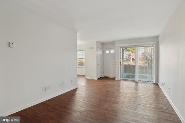 unfurnished room featuring dark wood-type flooring