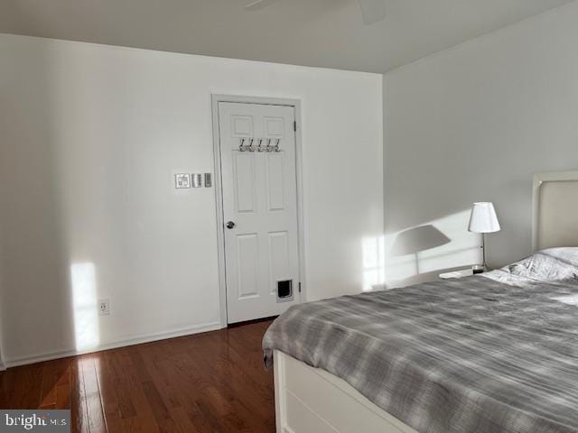 bedroom featuring dark hardwood / wood-style floors and ceiling fan