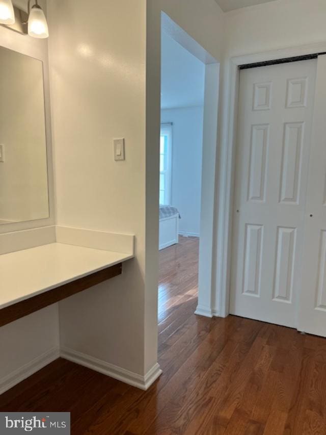 bathroom with wood-type flooring