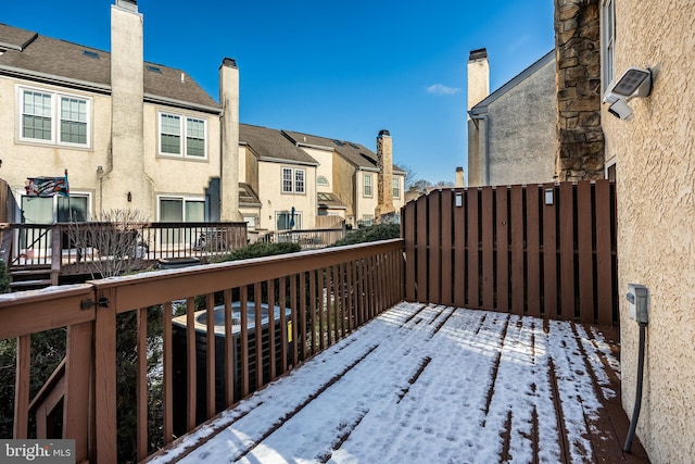 snow covered deck with central AC unit