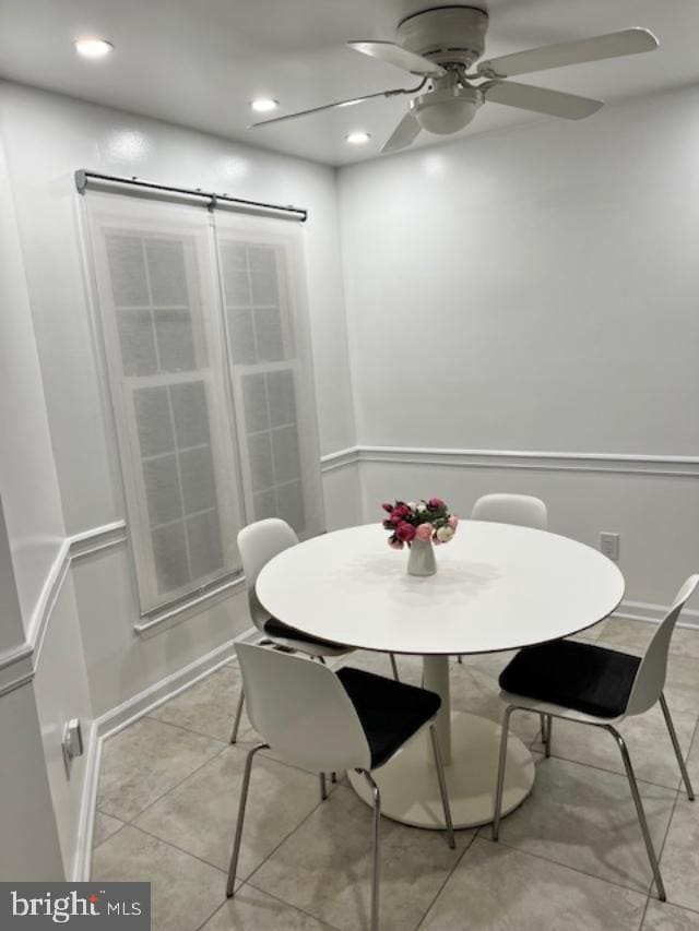 dining room with light tile patterned floors and ceiling fan