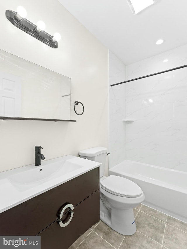 full bathroom with tiled shower / bath, tile patterned flooring, vanity, and toilet