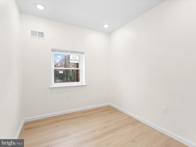 empty room with light hardwood / wood-style floors