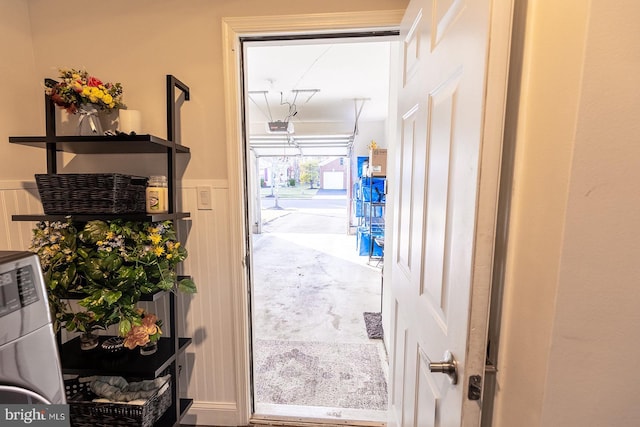 doorway to outside featuring washer / dryer