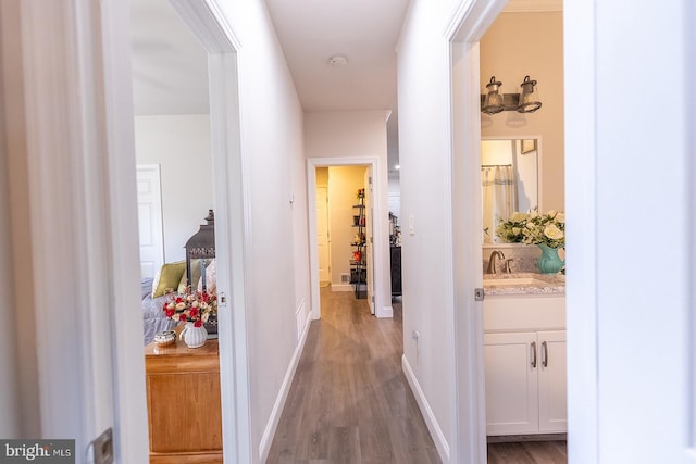 corridor with wood-type flooring