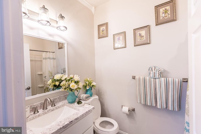 bathroom featuring vanity, toilet, walk in shower, and crown molding