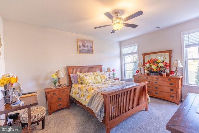 bedroom featuring ceiling fan and light colored carpet