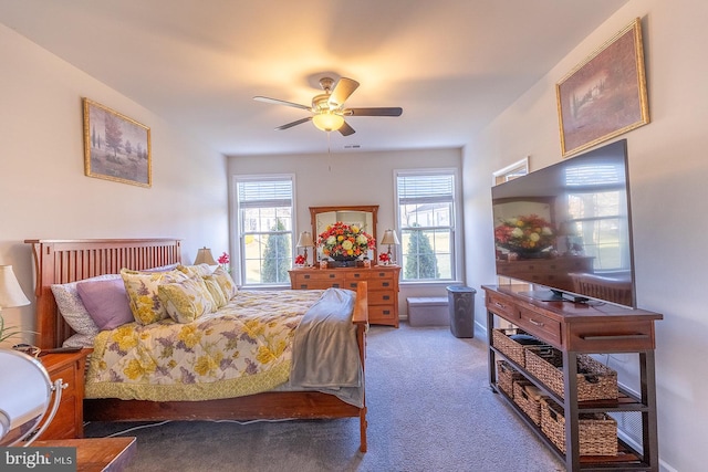 bedroom featuring ceiling fan and dark colored carpet