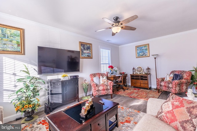 living room with ceiling fan, wood-type flooring, and ornamental molding