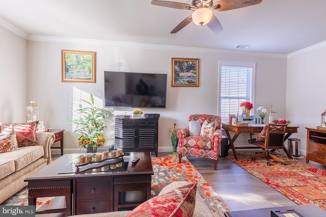 living room featuring ceiling fan, crown molding, and dark wood-type flooring