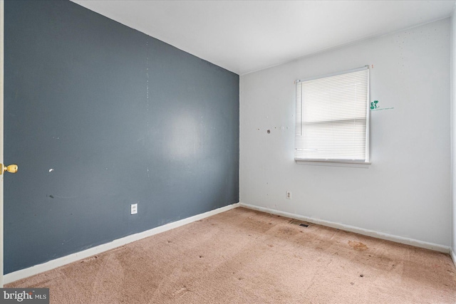 unfurnished room featuring carpet