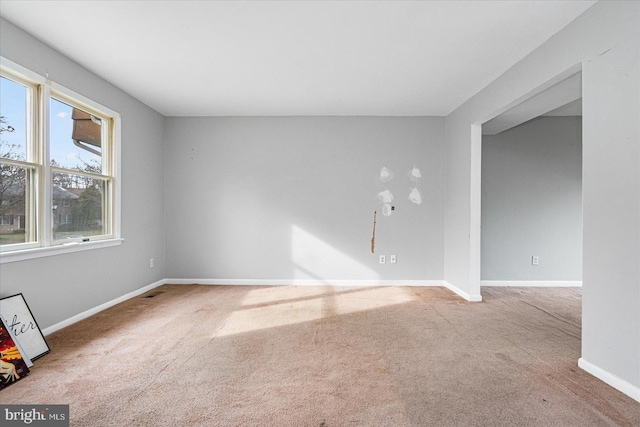 unfurnished room with carpet flooring