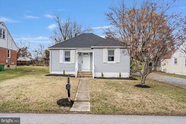 bungalow featuring a front yard