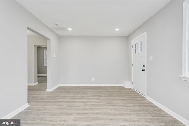 spare room with light hardwood / wood-style flooring