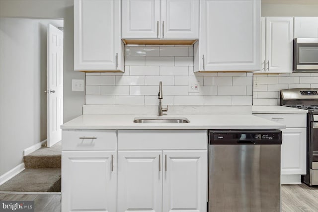 811 Rosedale Ave, Rosedale, MD 21237 - kitchen featuring sink, white cabinetry, stainless steel appliances, and light wood-type flooring