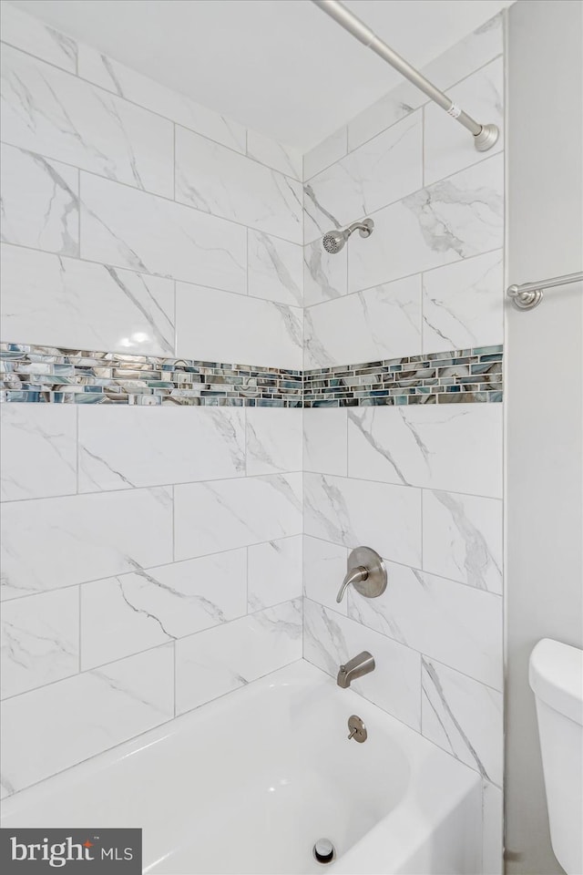 811 Rosedale Ave, Rosedale, MD 21237 - bathroom featuring tiled shower / bath combo and toilet