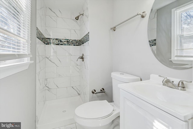 811 Rosedale Ave, Rosedale, MD 21237 - bathroom featuring a tile shower, vanity, and toilet