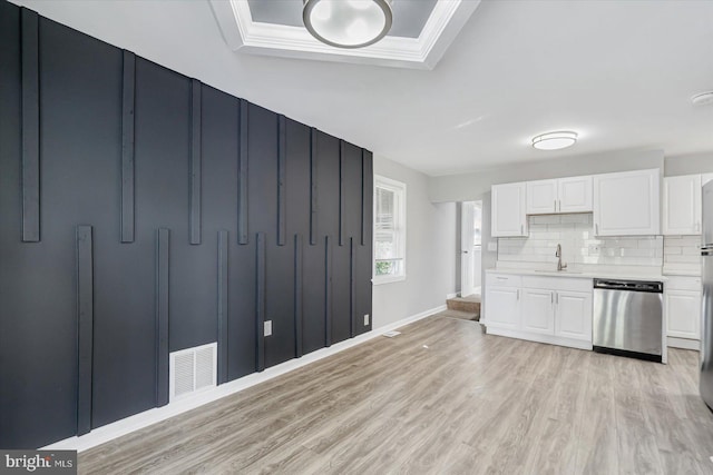 811 Rosedale Ave, Rosedale, MD 21237 - kitchen with white cabinets, tasteful backsplash, stainless steel dishwasher, and sink
