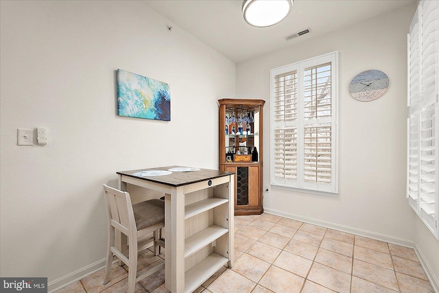 dining area featuring light tile patterned floors