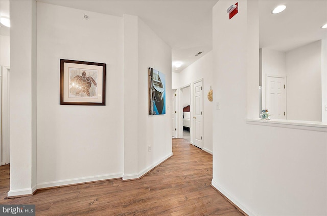 hallway featuring hardwood / wood-style floors