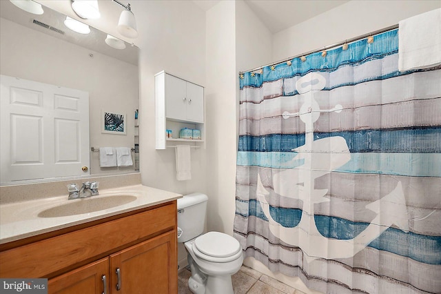 bathroom featuring tile patterned floors, curtained shower, vanity, and toilet