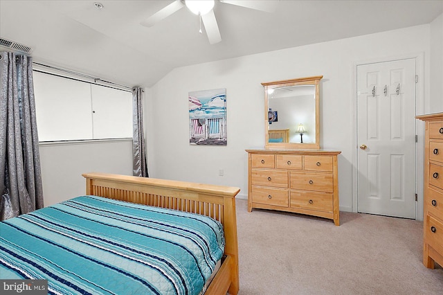 carpeted bedroom featuring vaulted ceiling and ceiling fan