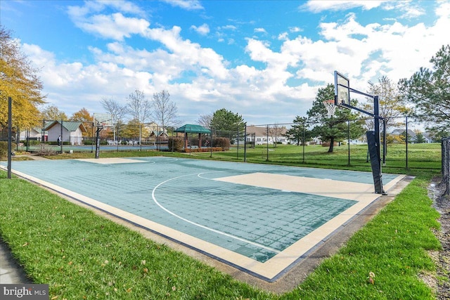 view of basketball court with a gazebo and a yard