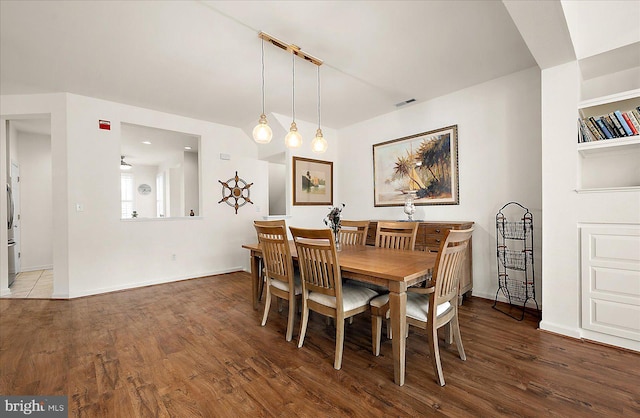 dining space featuring hardwood / wood-style flooring