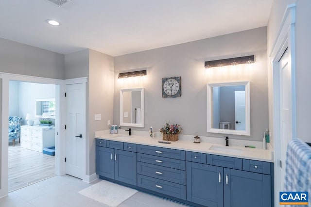 bathroom with vanity and tile patterned floors