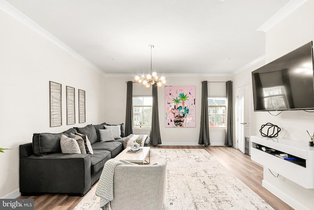 living room with crown molding, wood-type flooring, and an inviting chandelier