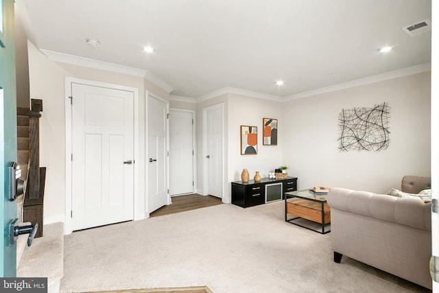 living room featuring carpet flooring and crown molding