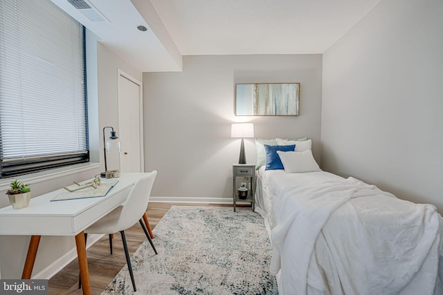 bedroom with hardwood / wood-style floors