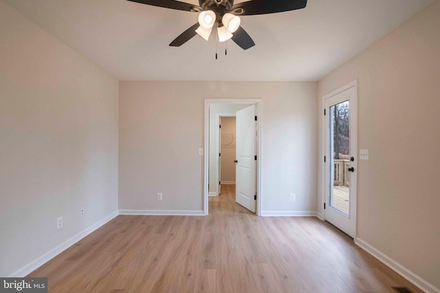 unfurnished room with ceiling fan and light wood-type flooring